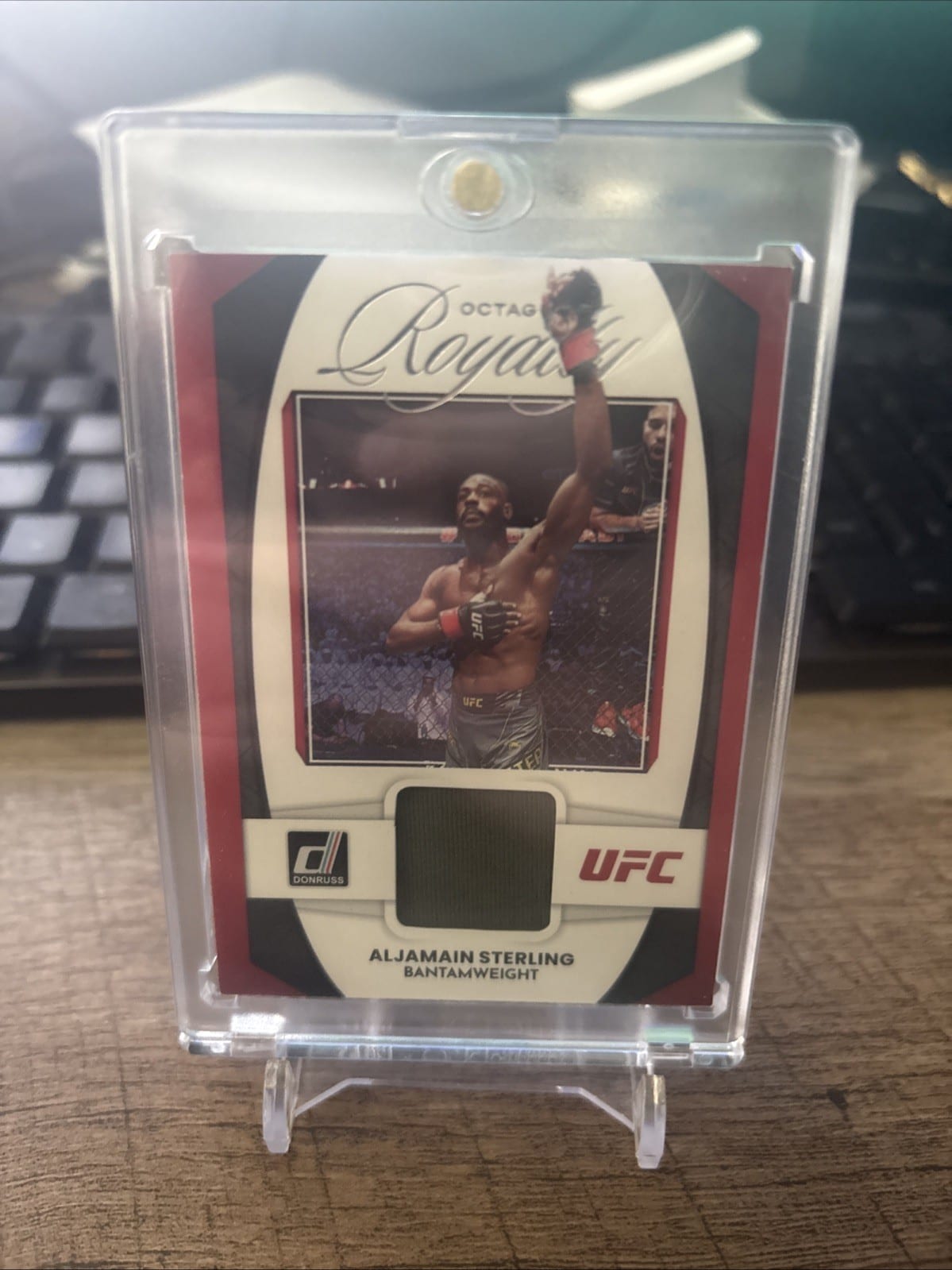 2023 Donruss UFC Aljamain Sterling Octagon Royalty Material Relic #OR-AST, photo
